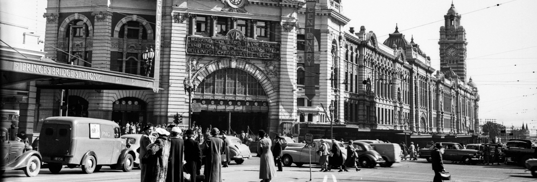Illumination of Flinders Street Station, 1954 centenary decorations, VPRS 12800 P1 Unit 194 H2681 A black and white photo of Flinders Street Station in 1954