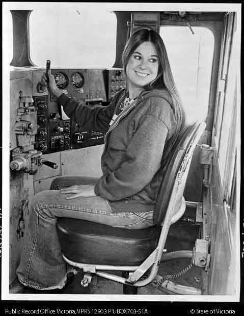 Driver of train with hippy hair