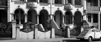 Black and white photo of a street scene, year and location unknown