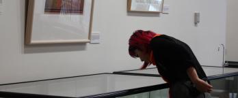 A woman looking at an exhibition