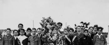 Black and white photo of boys at a cemetary