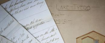 Colour image of documents and Lake Tyers plan. 