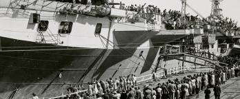 Black and white photo of HMS Glory docked at Melbourne