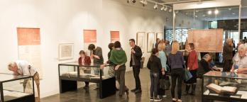 People enjoying an exhibition at PROV