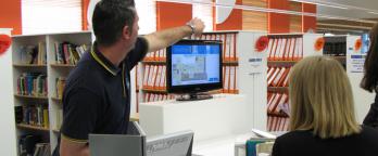 Support staff at help desk in archive