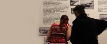 people looking at exhibition