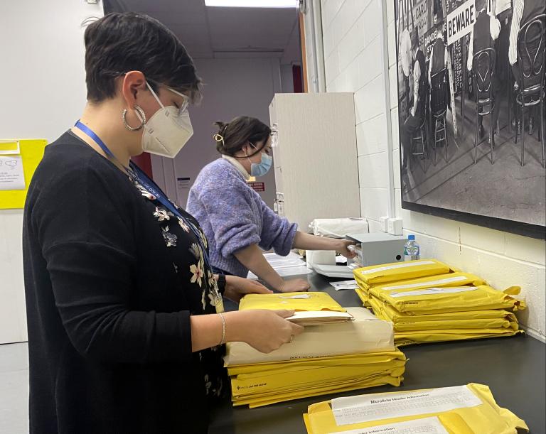 Imogen Telfer and Rebecca Lloyd processing files for VPRS 19163 Mining Tenement Files at the Victorian Archives Centre