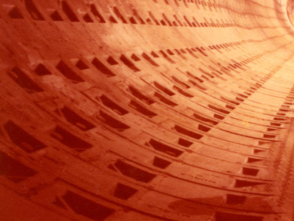 A photograph of a workman in a tunnel